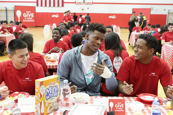 IMAGE DISTRIBUTED FOR KELLOGG COMPANY - Chicago Bulls All-Star Jimmy Butler spreads awareness that 1 in 5 children may go to school hungry by sharing a Kellogg's breakfast with students at a Chicago public high school on Wednesday, March 4, 2015 in Chicago, Ill. (Jean-Marc Giboux/ AP Images for Kellogg Company) ORG XMIT: CPANY100